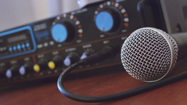 Picture of a microphone connected to an audio mixer device